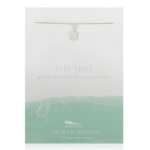 Lucky Feather Sea Turtle Necklace on display card reading "Stay chill peace out like the sea turtle". Silver sea turtle charm on nylon cord.