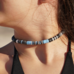 Storm Front sky blue, white, black, & gray heishi choker necklace on model neck.