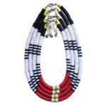 Volcanic Necklace of white, black, red, yellow, & turquoise heishi beads in multiple lengths nested together in a teardrop shape.