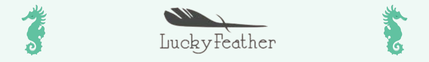 Lucky Feather Logo of gray feather with company name beneath in center of banner. Spearmint seahorses on either side of logo facing out.