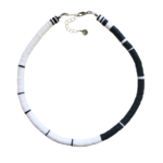 Cavern Necklace of white and black heishi beads on white background.