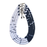 Four Cavern Necklaces of white and black heishi beads nested together in teardrop shape on white background.