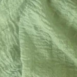 Rubyzaar Pea Green Boho Shawl displayed close to show color of fabric.