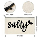 Salty Canvas Zipper Pouch displayed on white background displaying that the pouch is 8 inches wide and 4.5 inches tall. 2 detailed view circles above main image. First circle is close up view of black zipper. Second circle is close up view of light beige canvas fabric. Salty printed on light beige pouch in black script writing. End of Y is a mermaid tail.