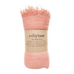 The Boho Shawl Peach rolled up with Rubyzaar packaging of brown paper with product name and description written in black. Displayed on white background.