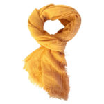 The Boho Shawl Saffron displayed in knot pattern on white background.