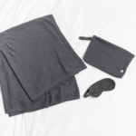 Travel Set Dark Gray displayed on white background. Set includes blanket, eye mask, and travel pouch.