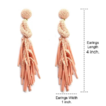 Coral Peach Beaded Post Statement Earrings shown on white background. Displaying the earring length of 4 inches and width of 1 inch. Post earring is made with coral / peach seed and bugle beads and is in a knot pattern with beaded fringe hanging down below the knot.