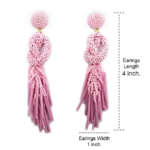 Pink Beaded Knot Post Statement Earrings shown on white background. Displaying the earring length of 4 inches and width of 1 inch. Post earring is made with pink seed and bugle beads and is in a knot pattern with beaded fringe hanging down below the knot.