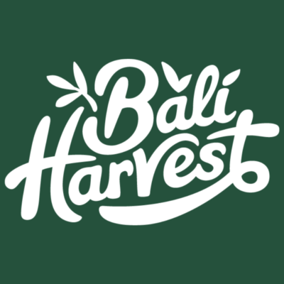 Bali Harvest logo of company name in white script lettering with plant leaf accents. Logo is white on dark green background.